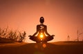 Yoga position silhouette in contrasting sun, Sacral chakra Royalty Free Stock Photo