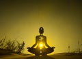 Yoga position silhouette in contrasting sun, Solar Plexus chakra