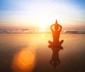 Yoga practicing at sunset. Royalty Free Stock Photo