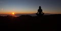 Yoga practicioner during the sunset meditation Royalty Free Stock Photo