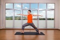 Yoga practitioner performing Warrior 2 or Virabhadrasana 2 pose Royalty Free Stock Photo