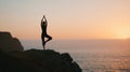 Yoga Practitioner In Tree Pose On Cliff At Sunset. Serenity And Balance In Nature Royalty Free Stock Photo