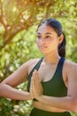 Yoga, praying hands and woman in nature for wellness, balance and peace on bokeh background. Pose, meditation and girl Royalty Free Stock Photo