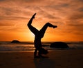 Yoga, silhouette or handstand pose on sunset beach, ocean or sea in evening workout or relax exercise training. Yogi Royalty Free Stock Photo