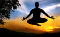 Yoga silhouette lotus pose in jumping Royalty Free Stock Photo