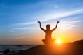 Yoga silhouette. Meditation fitness woman on the Sea beach during amazing sunset. Royalty Free Stock Photo