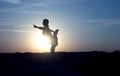 Yoga Silhouette meditation girl on the background of the sunset , fitness and healthy lifestyle Royalty Free Stock Photo