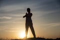 Yoga Silhouette meditation girl on the background of the sunset , fitness and healthy lifestyle Royalty Free Stock Photo