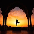 Yoga silhouette in old temple at sunset sky background. Royalty Free Stock Photo