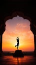 Yoga silhouette in old temple at sunset sky background. Royalty Free Stock Photo