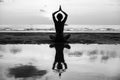 Yoga silhouette. Woman doing meditation near the ocean beach. Royalty Free Stock Photo