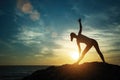 Yoga silhouette young woman doing fitness exercises on the beach Royalty Free Stock Photo