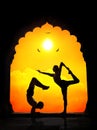 Yoga silhouettes in temple Royalty Free Stock Photo