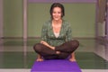 Professional yoga trainer posing in yoga in fitness class