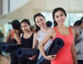 Yoga teacher and her student carry a mat and waiting in fitness Royalty Free Stock Photo