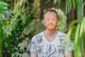 Yoga teacher portrait. Red hair man with a red beard