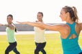 Yoga teacher and sporty women attending yoga class Royalty Free Stock Photo