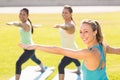 Yoga teacher and sporty women attending yoga class Royalty Free Stock Photo