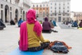 Yoga teachers protesting against the blockade and restrictions of Covid-19 in a square in Brescia, Italy. The people sitting on Royalty Free Stock Photo