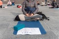 Yoga teachers protesting against the blockade and restrictions of Covid-19 in a square in Brescia, Italy. The people sitting on Royalty Free Stock Photo