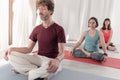 Yoga teachers sitting in the lotus position