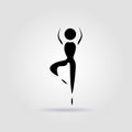 Yoga vrikshasana pose black icon on gray background with soft shadow