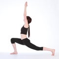 Yoga Warrior One pose Virabhadrasana by fit woman