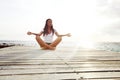 Yoga woman meditating near sea Royalty Free Stock Photo