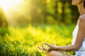 Yoga woman meditating at sunset Royalty Free Stock Photo