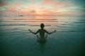 Yoga woman meditation near the ocean beach. Silhouette. Royalty Free Stock Photo