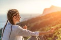 Yoga woman mountains. Profile of a woman doing yoga in the top of a cliff in the mountain. Woman meditates in yoga asana Royalty Free Stock Photo