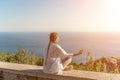 Yoga woman mountains. Profile of a woman doing yoga in the top of a cliff in the mountain. Woman meditates in yoga asana Royalty Free Stock Photo