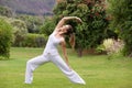 Yoga woman practising outside in park