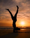 Yoga woman, silhouette or handstand on sunset beach, ocean or sea in workout or relax exercise training. Yogi, pilates Royalty Free Stock Photo