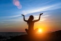 Yoga woman silhouette at Ocean beach during amazing sunset. Meditation Royalty Free Stock Photo