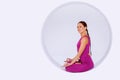 Yoga woman sitting in geometric sphere.