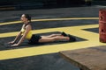 Yoga workout. Fitness woman stretching body, exercising outdoors Royalty Free Stock Photo