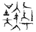 Yoga Workout. Silhouettes of a woman in Yoga Asanas Royalty Free Stock Photo