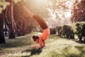 Yoga. mixed race woman practicing yoga or dancing or stretching in nature at park. Handstand. Health lifestyle concept