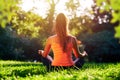 Yoga. Young woman practicing yoga or dancing or stretching in nature at park. Health lifestyle concept