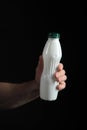 Yoghurt bottle with healthy drink in hand of man Royalty Free Stock Photo