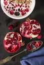 Yoghurt with cereals and fresh forest fruits and sliced pomegranate. Royalty Free Stock Photo