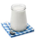 Yoghurt, cream, sour cream in a glass jar and spoon