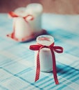 Yoghurt, cream, sour in a glass jar with tape polka dots on napkin, towel