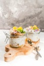 Yoghurt with granola, orange, mint and edible flowers Royalty Free Stock Photo