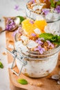Yoghurt with granola, orange, mint and edible flowers Royalty Free Stock Photo