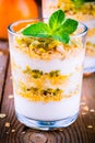 Yoghurt granola parfait with passion fruit sauce and mint Royalty Free Stock Photo