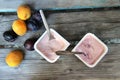 Yoghurts on the wooden table Royalty Free Stock Photo