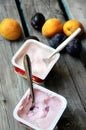 Yoghurts on the wooden table Royalty Free Stock Photo