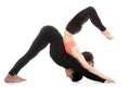 Yogi couple in yoga downward-facing dog and scorpion poses Royalty Free Stock Photo